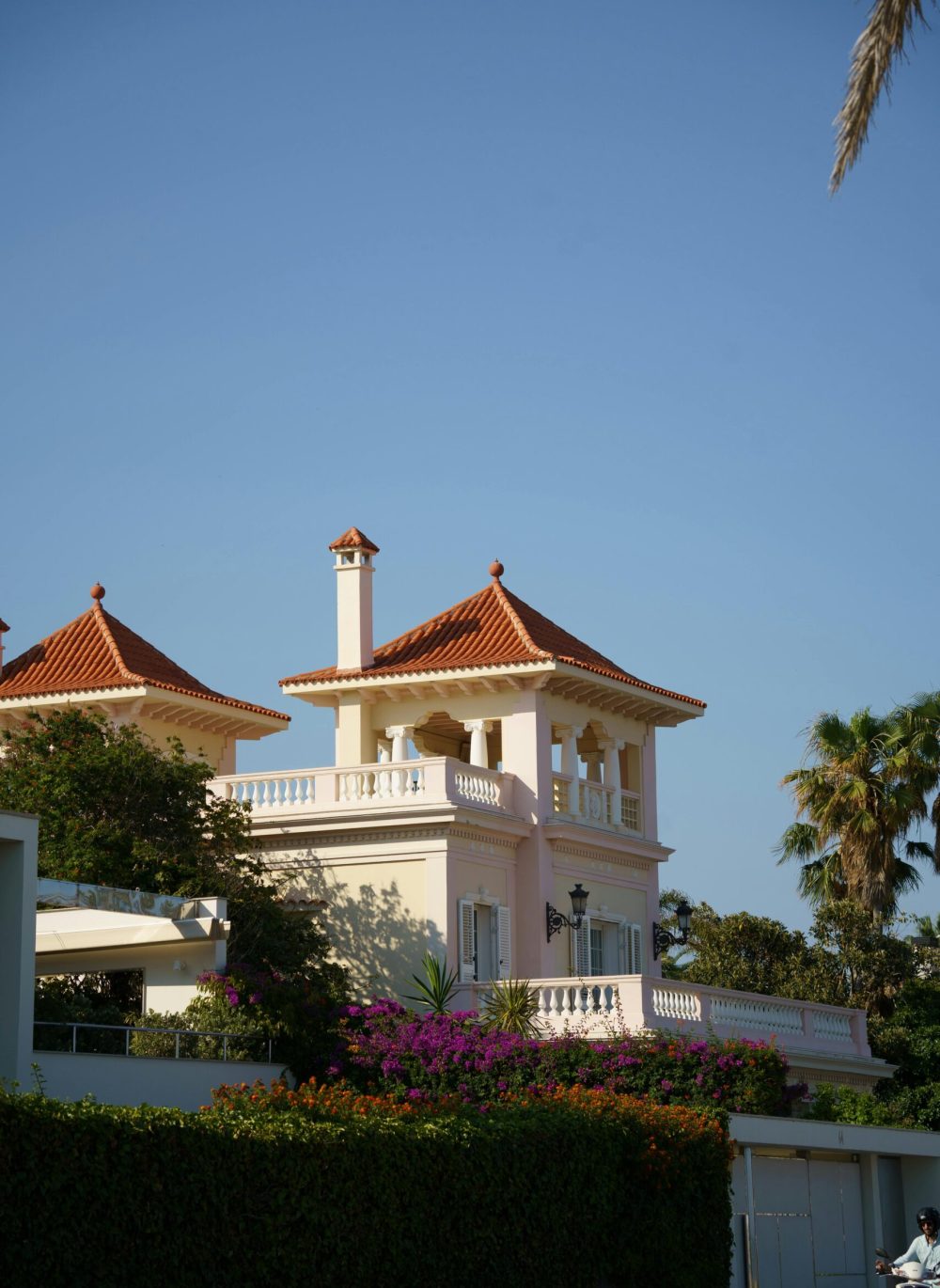 Stunning villa in Sitges, Spain featuring Mediterranean architecture and a vibrant garden.
