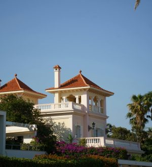 Stunning villa in Sitges, Spain featuring Mediterranean architecture and a vibrant garden.