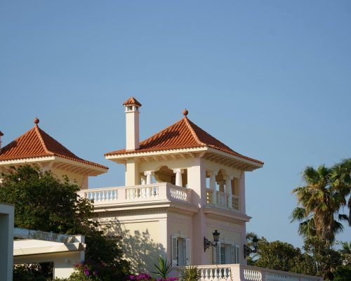 Stunning villa in Sitges, Spain featuring Mediterranean architecture and a vibrant garden.